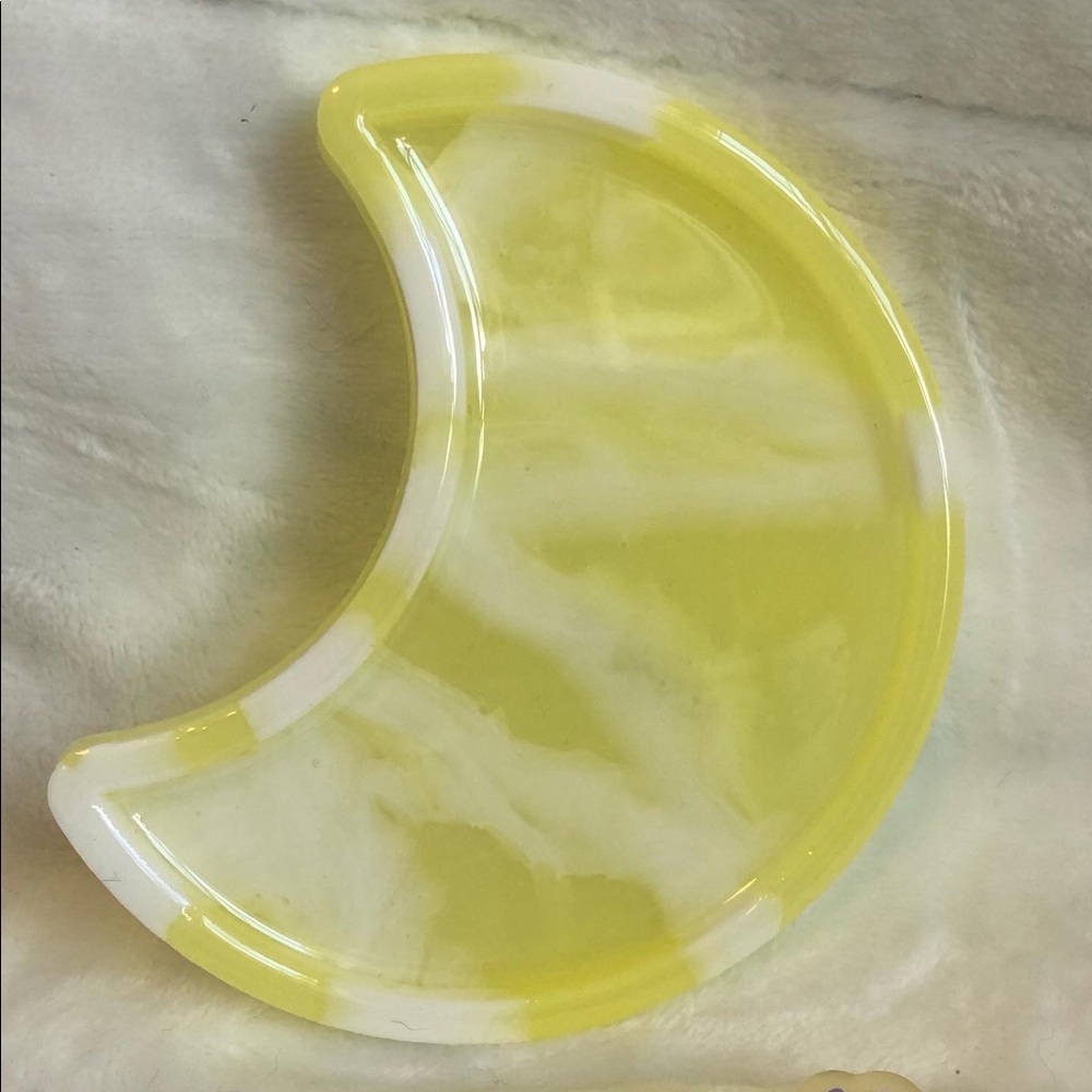 Resin crescent moon tray, about 5in long.